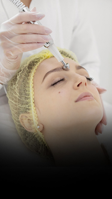 Patient receiving microneedling and laser treatment for scars
